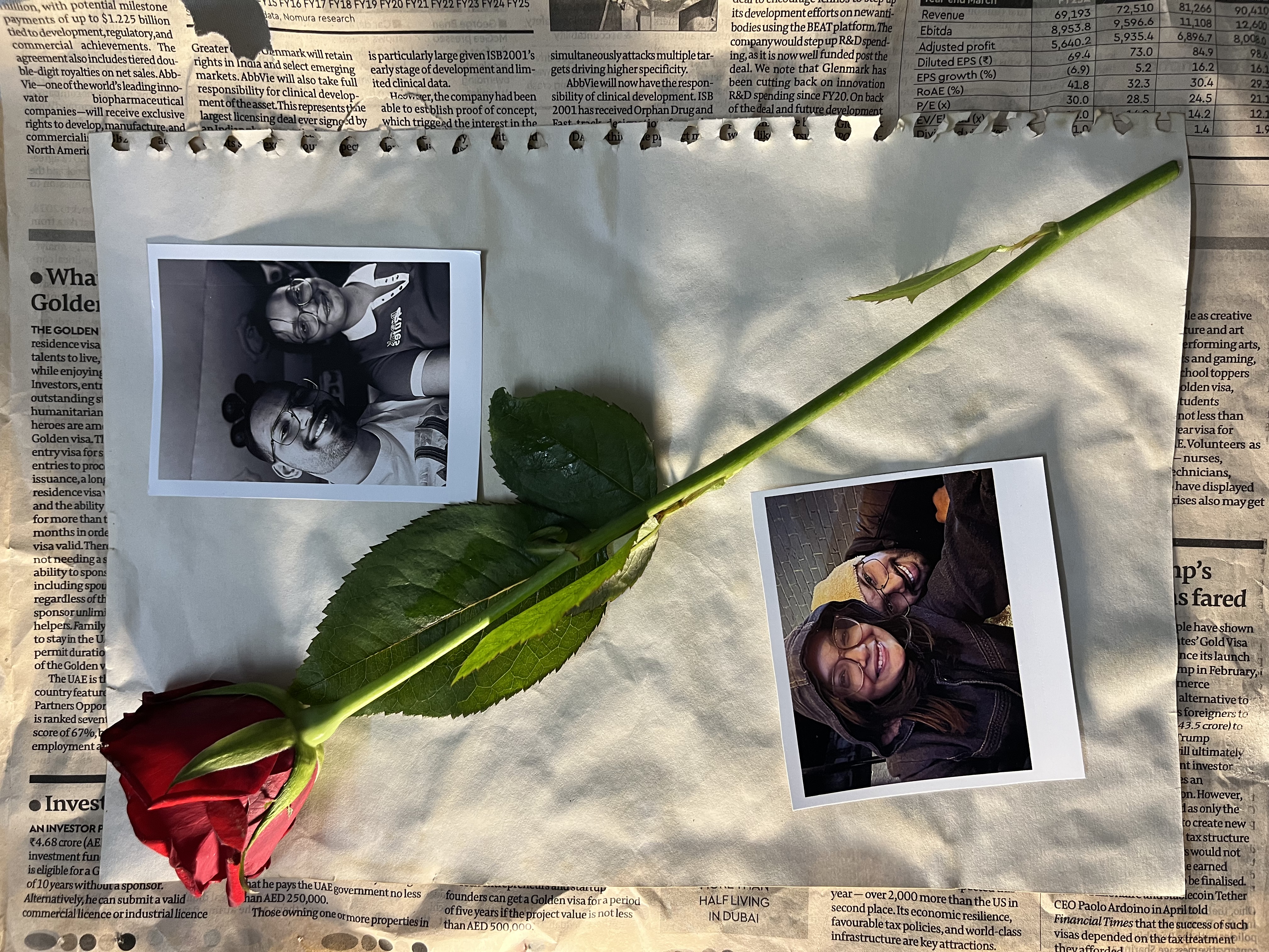 A rose and two polaroids as a promise